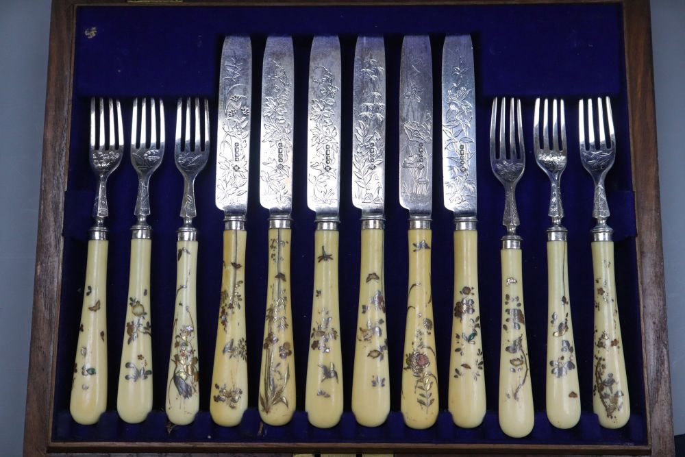 A cased set of twelve pairs of Victorian shibayama handled silver dessert eaters, Martin, Hall & Co, Sheffield, 1881,